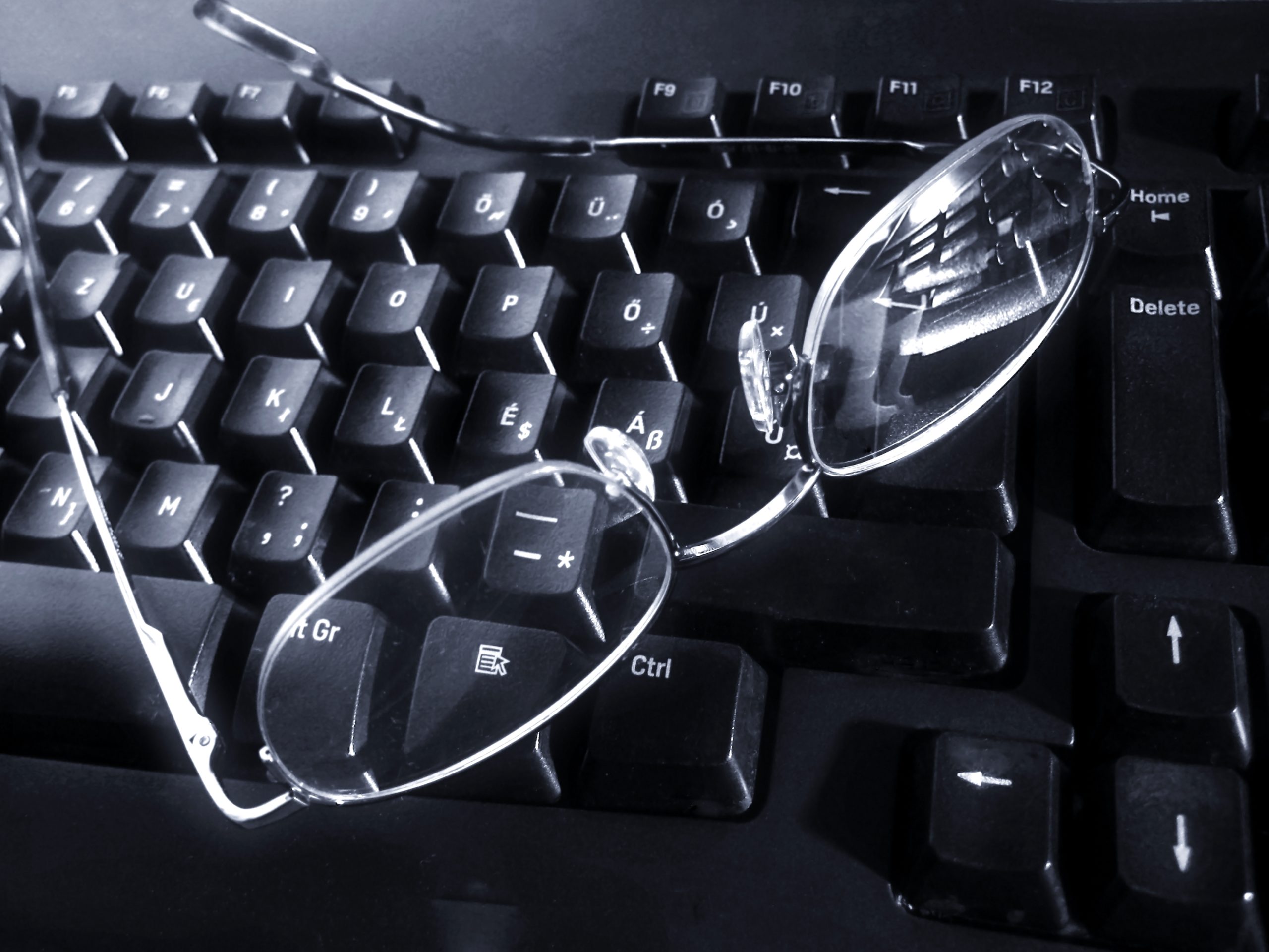 Glasses sitting on Keyboard
